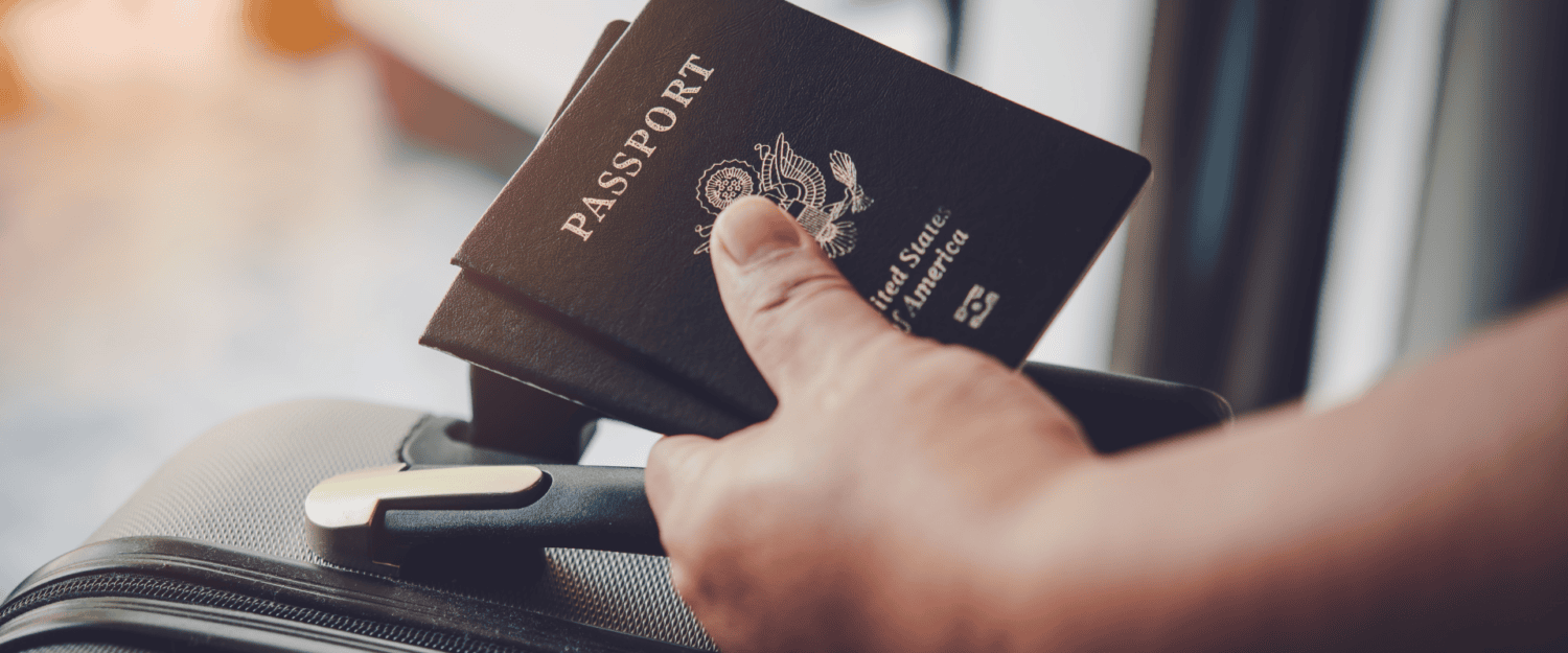 Person holding two passports