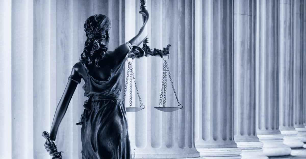 Lady Justice statue in front of pillars